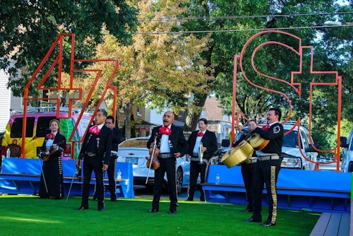 Mariachi band performing for crowd