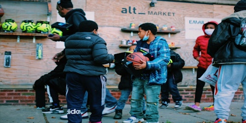 people gathering at the outside market