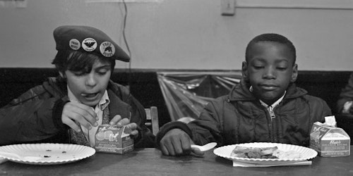 kids sitting a table eating