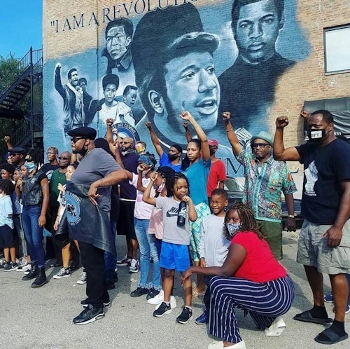 Community members gathered at the Fred Hampton Mural