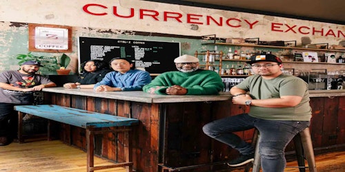 Three men standing in resturant