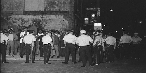 police standing outside after a raid