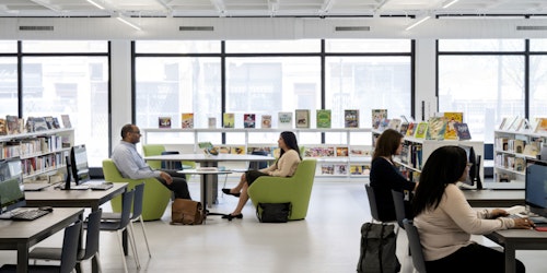 Image of people sitting in library with bright open windows